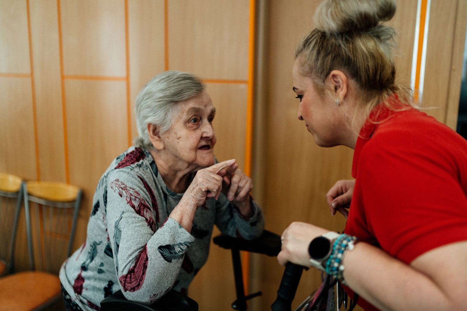 Support worker and client having a warm conversation at home, representing Betterway Care Services person-centred approach