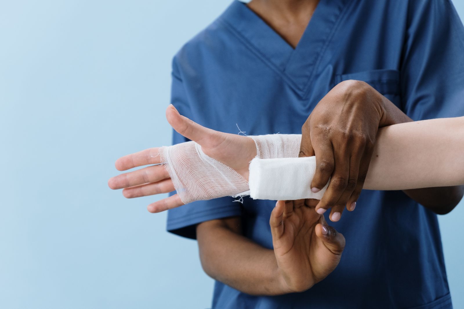 Registered nurse providing clinical wound care during a home visit, representing Betterway Care Services community nursing